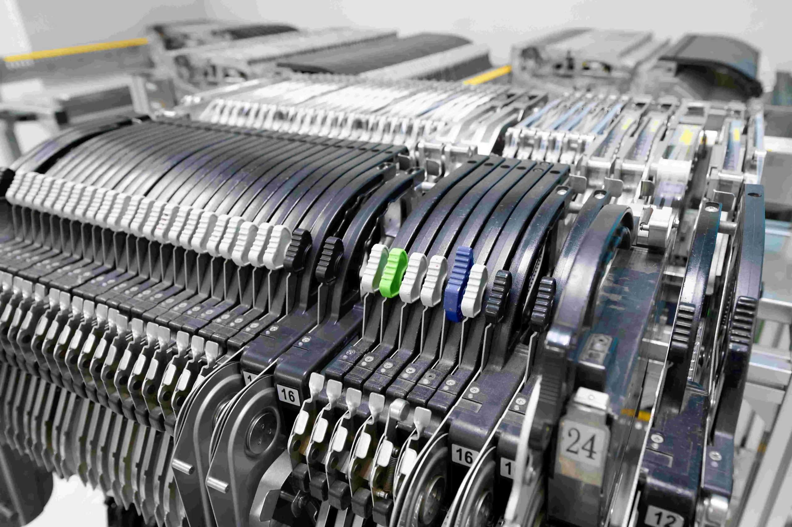 Multiple SMT tape feeders installed in a pick-and-place machine feeder bank